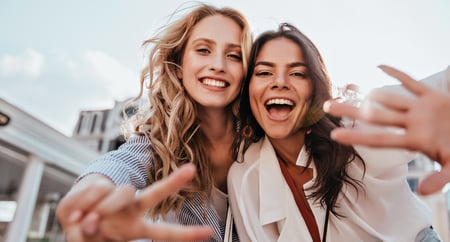 two egg donors laughing and posing