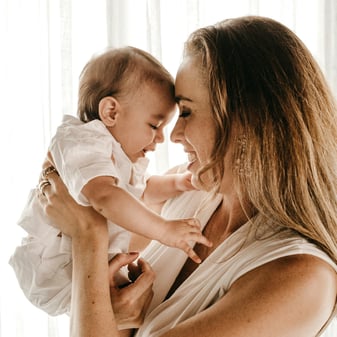 Mother cradling her newborn born via egg donation highlighting the profound biological connection through epigenetics